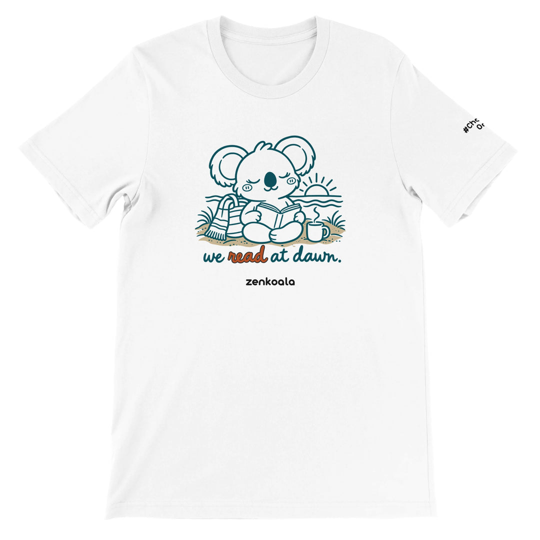 We Read at Dawn feel-good tee in white: a koala reading on the beach, Zen Koala Australia