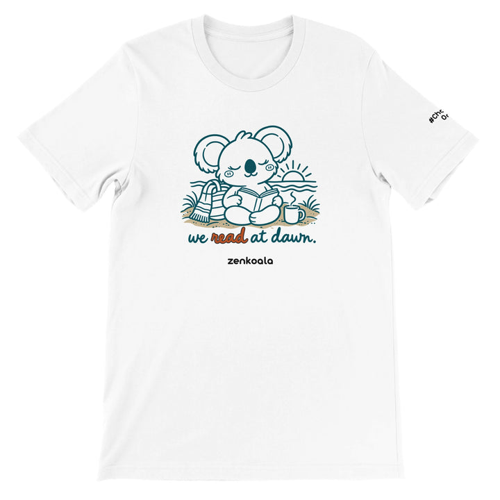 We Read at Dawn feel-good tee in white: a koala reading on the beach, Zen Koala Australia