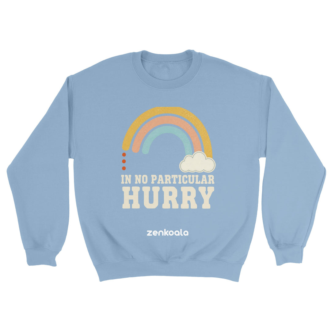 In No Particular Hurry feel-good sweatshirt in light blue — a retro pastel rainbow and cloud, Zen Koala Australia