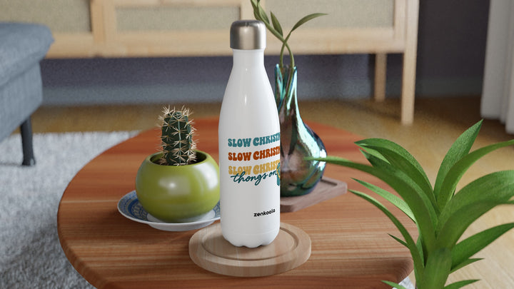 Slow Christmas Thongs On water bottle on a wooden table with a cactus, Zen Koala Australia