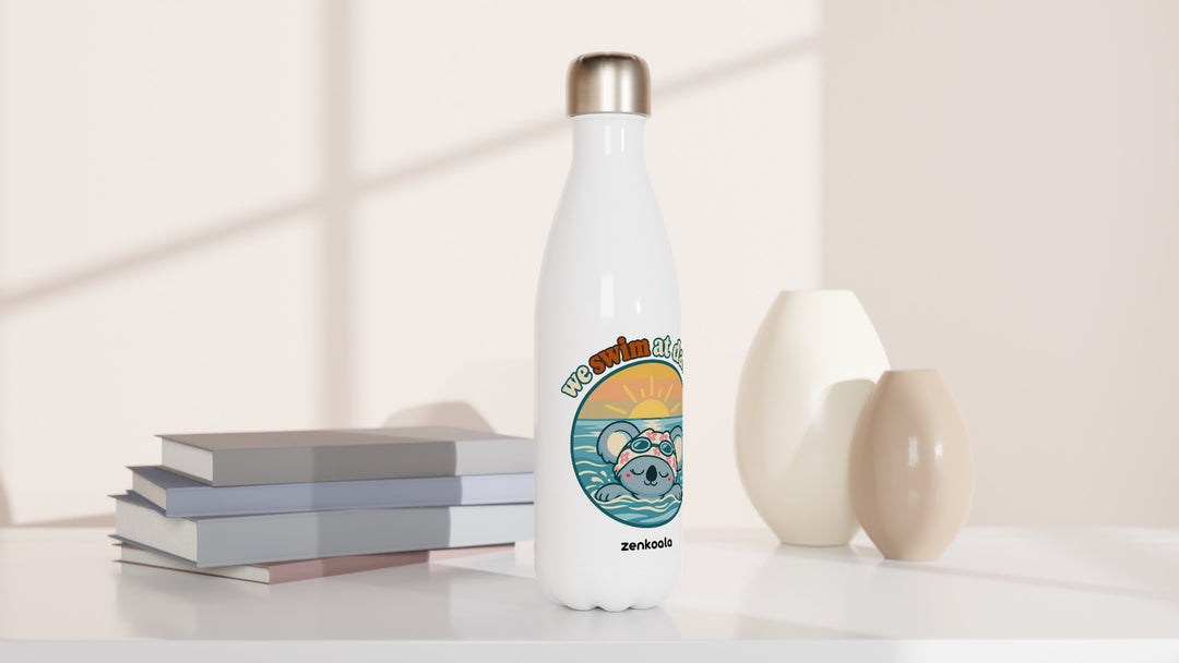We Swim at Dawn water bottle beside books and vases, Zen Koala Australia