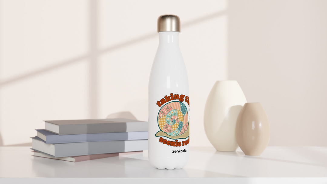 Taking the Scenic Route Snail water bottle beside books and vases, Zen Koala Australia