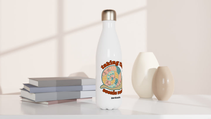 Taking the Scenic Route Snail water bottle beside books and vases, Zen Koala Australia