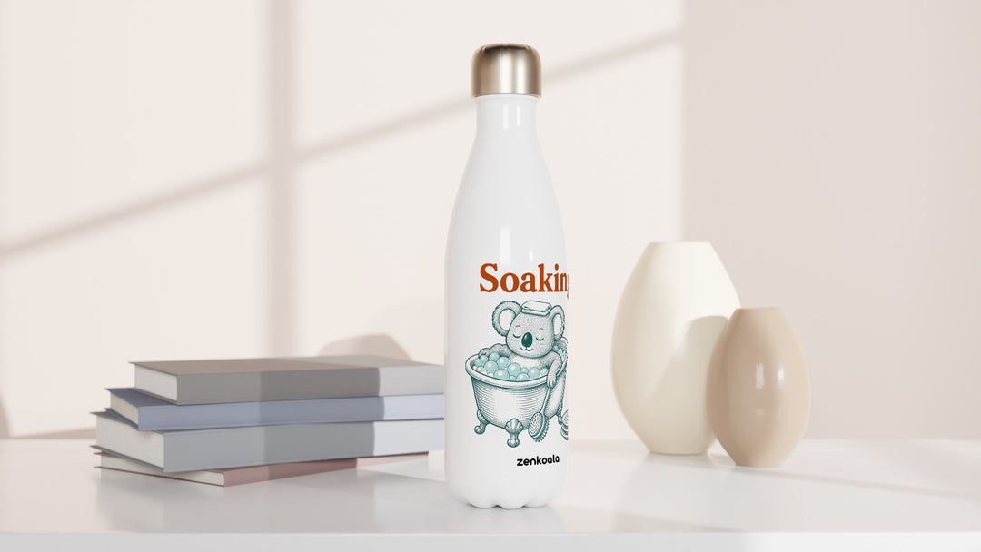 Soaking Koala Bath water bottle beside books and vases, Zen Koala Australia