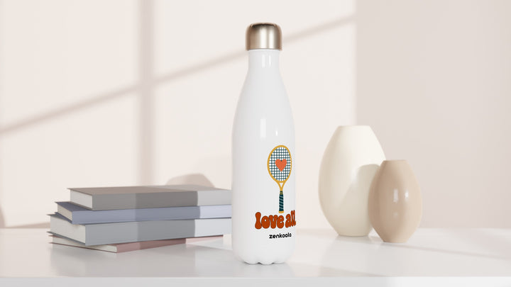 Love All water bottle beside books and vases, Zen Koala Australia