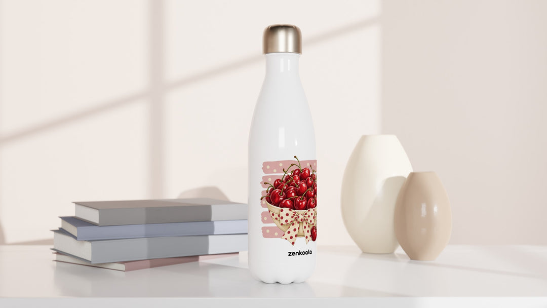 Cherries water bottle beside books and vases, Zen Koala Australia