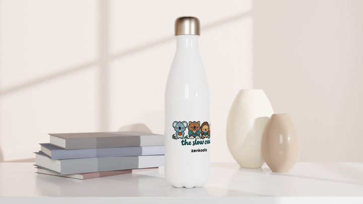 The Slow Crew water bottle beside books and vases, Zen Koala Australia