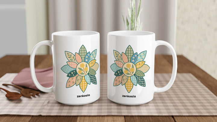 Two Wattle Mandala 15oz mugs on a table, showing both sides of the design, Zen Koala Australia