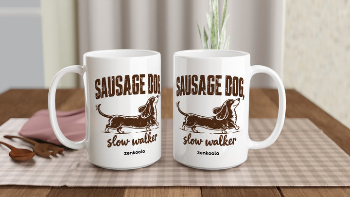 Two Sausage Dog Slow Walker 15oz mugs on a table, showing both sides of the design, Zen Koala Australia