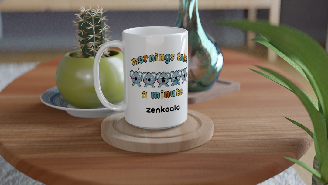 Mornings Take a Minute 15oz mug on a wooden table with a cactus, Zen Koala Australia