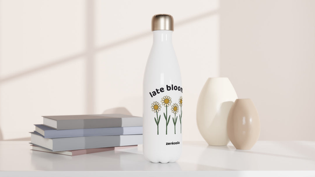 Late Bloomer water bottle beside books and vases, Zen Koala Australia