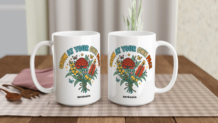 Two Grow at Your Own Pace 15oz mugs on a table, showing both sides of the design, Zen Koala Australia