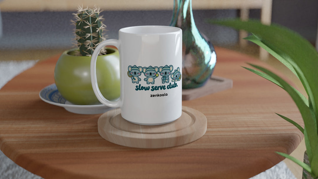 Slow Serve Club 15oz mug on a wooden table with a cactus, Zen Koala Australia
