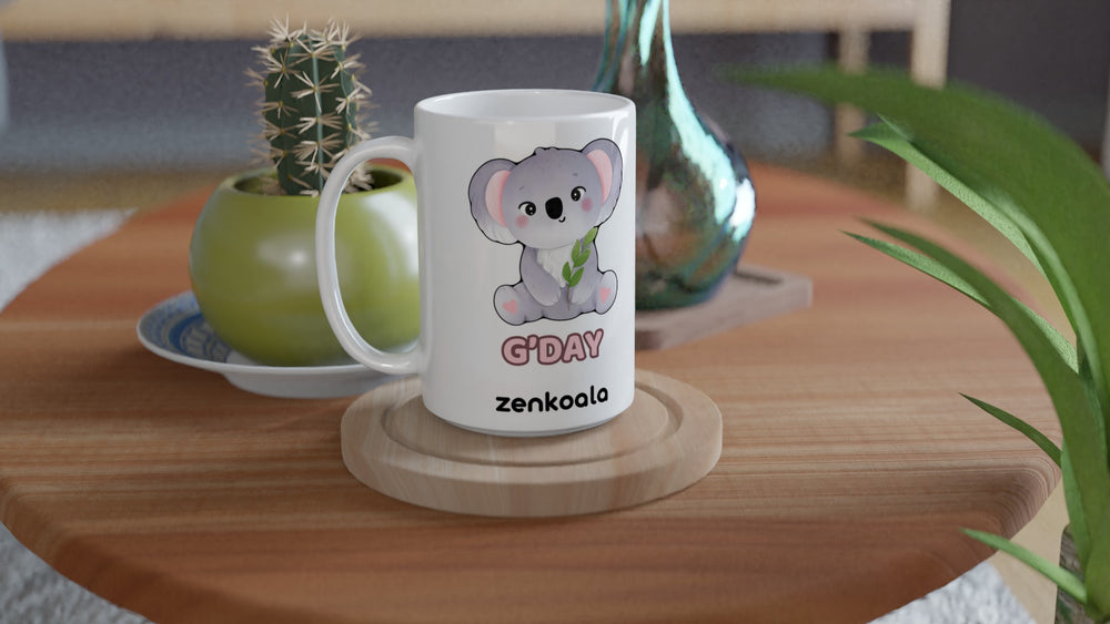 G'Day Koala 15oz mug on a wooden table with a cactus, Zen Koala Australia
