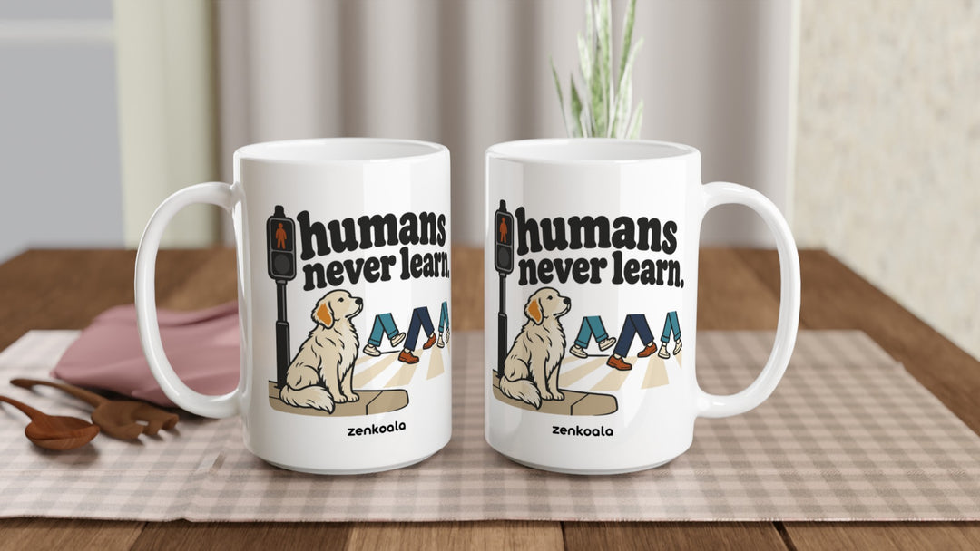 Two Humans Never Learn 15oz mugs on a table, showing both sides of the design, Zen Koala Australia