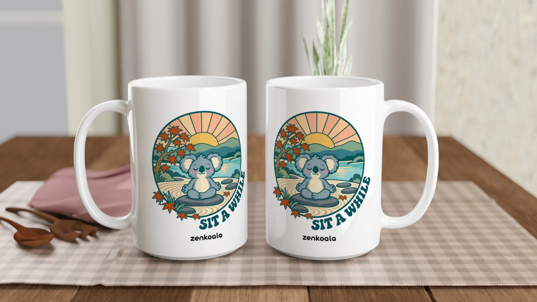 Two Sit a While 15oz mugs on a table, showing both sides of the design, Zen Koala Australia