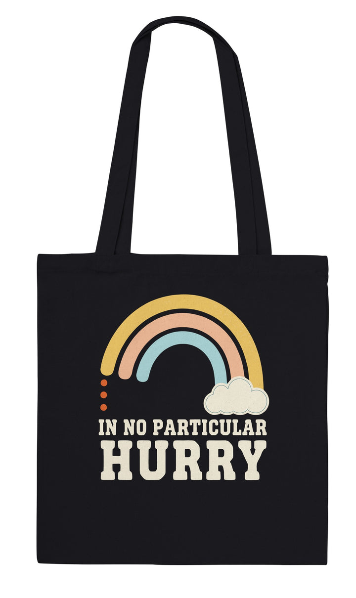 In No Particular Hurry feel-good tote bag in black: a soft retro rainbow and a fluffy cloud, Zen Koala Australia