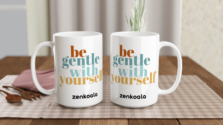 Two Be Gentle 15oz mugs on a table, showing both sides of the design, Zen Koala Australia