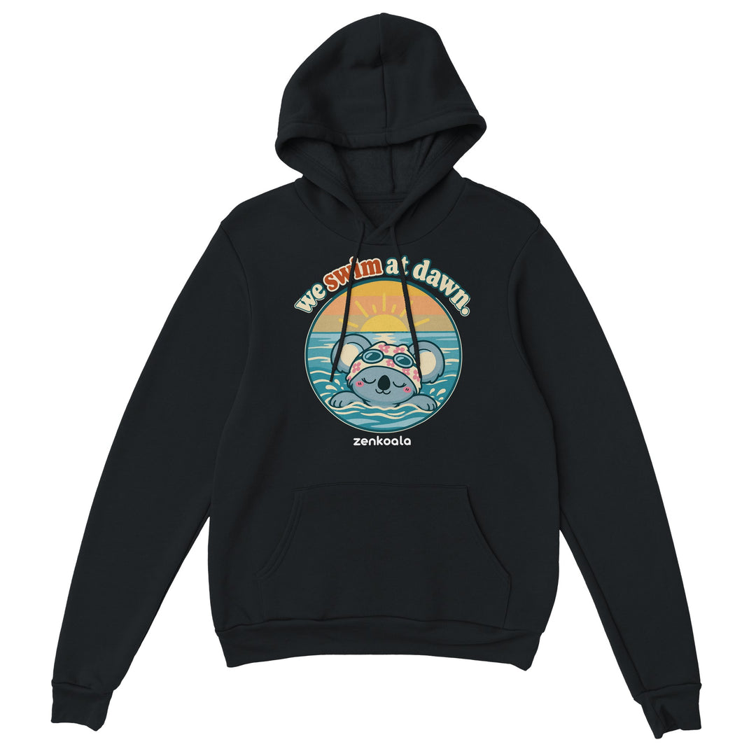 We Swim at Dawn feel-good hoodie in black: a koala swimming at sunrise, Zen Koala Australia