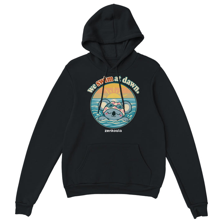 We Swim at Dawn feel-good hoodie in black: a koala swimming at sunrise, Zen Koala Australia