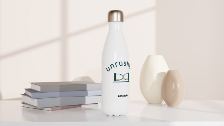 Unrushed water bottle beside books and vases, Zen Koala Australia