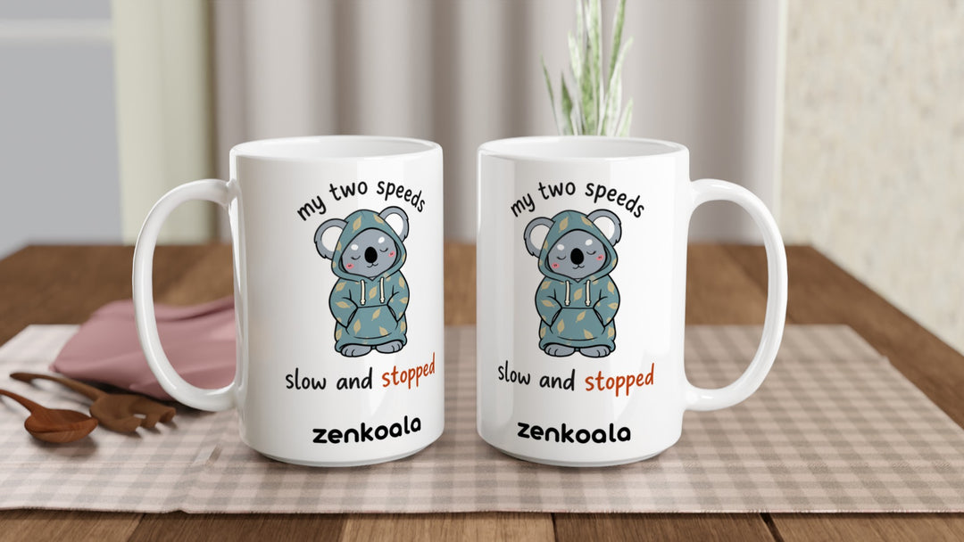 Two My Two Speeds Slow and Stopped 15oz mugs on a table, showing both sides of the design, Zen Koala Australia