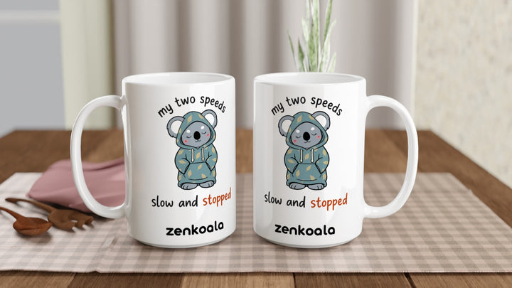 Two My Two Speeds Slow and Stopped 15oz mugs on a table, showing both sides of the design, Zen Koala Australia