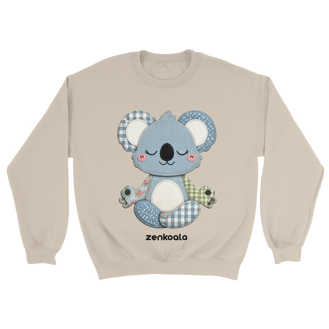 Faux Patchwork Meditating Koala feel-good sweatshirt in Sand — a cosy patchwork-look koala in gingham, polka dots and florals, Zen Koala Australia