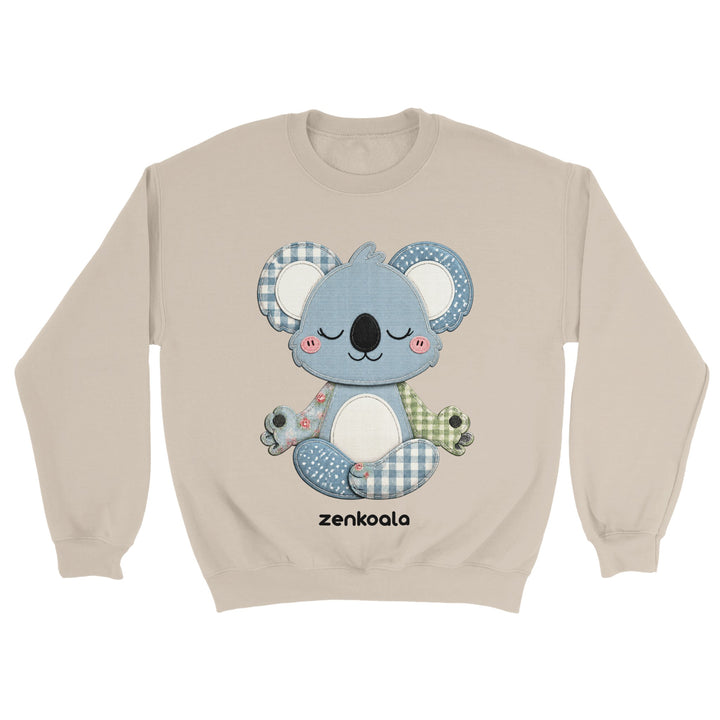 Faux Patchwork Meditating Koala feel-good sweatshirt in Sand — a cosy patchwork-look koala in gingham, polka dots and florals, Zen Koala Australia