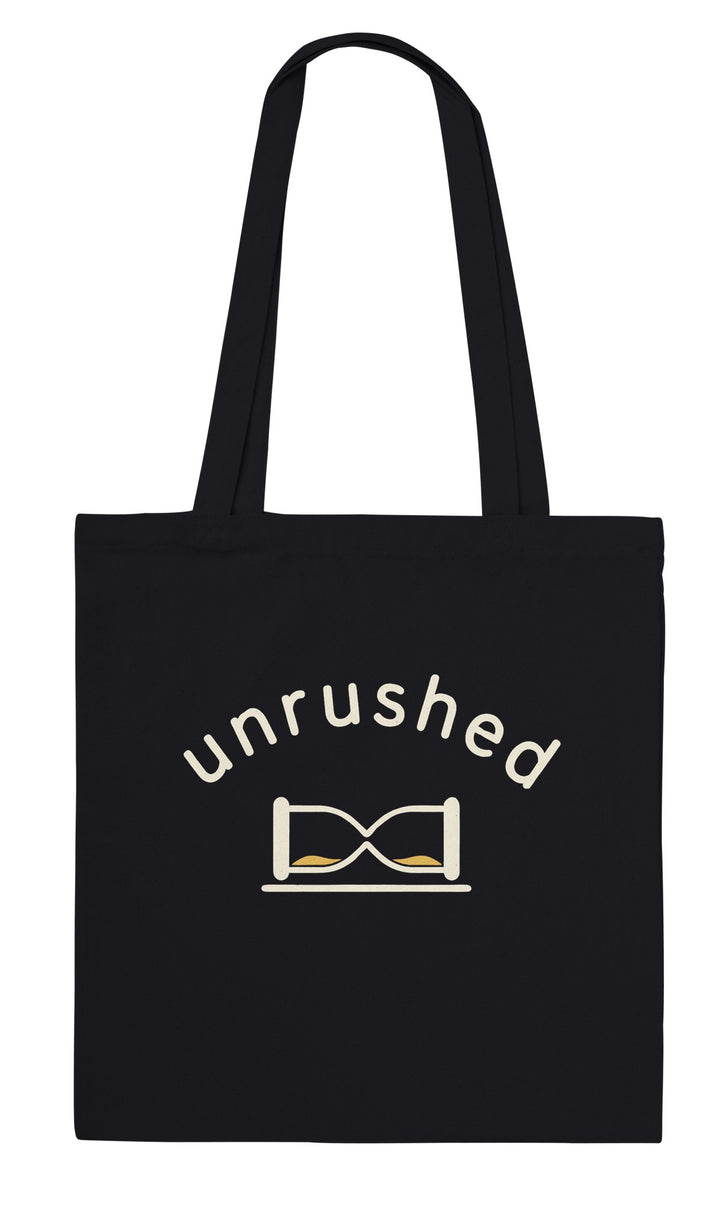 Unrushed feel-good tote bag in black: a minimalist hourglass tipped on its side, Zen Koala Australia