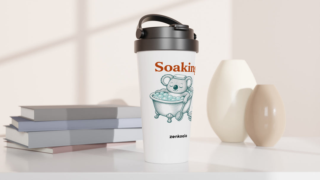 Soaking Koala Bath travel mug beside books and vases, Zen Koala Australia