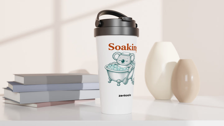 Soaking Koala Bath travel mug beside books and vases, Zen Koala Australia