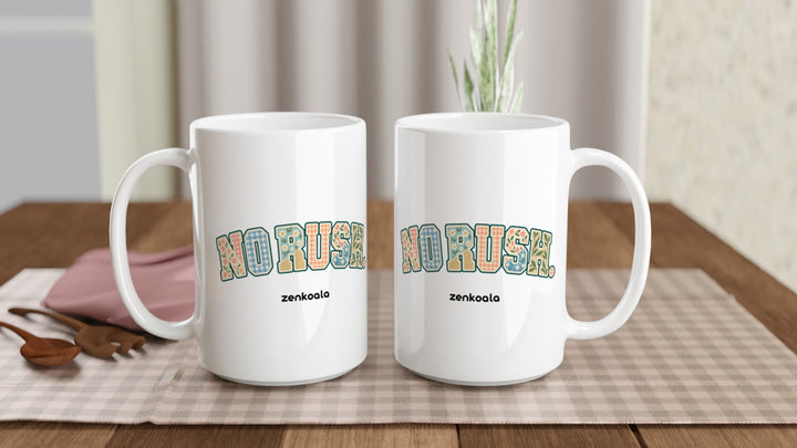 Two No Rush Faux Patchwork 15oz mugs on a table, showing both sides of the design, Zen Koala Australia