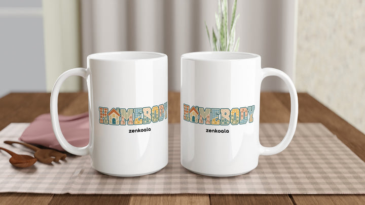 Two Homebody Faux Patchwork 15oz mugs on a table, showing both sides of the design, Zen Koala Australia