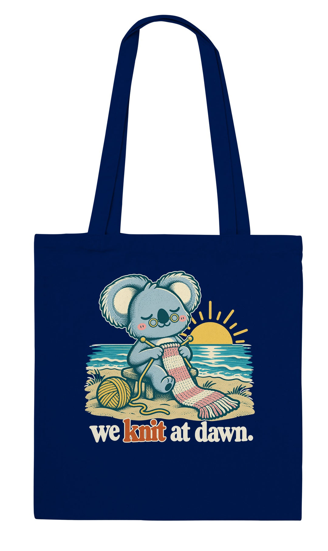 We Knit at Dawn feel-good tote bag in navy: a koala knitting on the beach, Zen Koala Australia