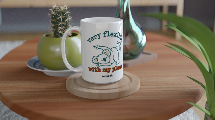 Very Flexible With My Plans 15oz mug on a wooden table with a cactus, Zen Koala Australia