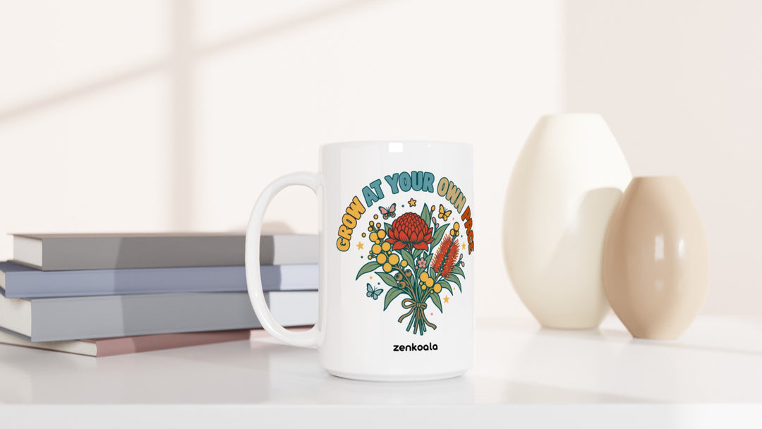 Grow at Your Own Pace 15oz mug beside books and vases, Zen Koala Australia