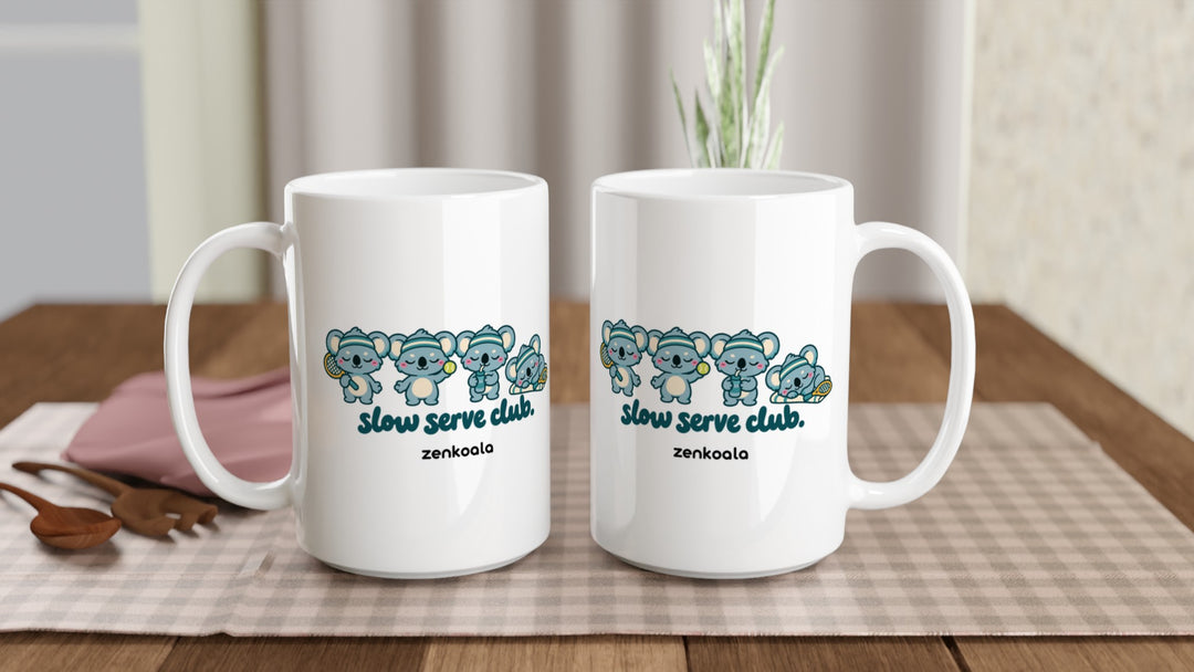 Two Slow Serve Club 15oz mugs on a table, showing both sides of the design, Zen Koala Australia