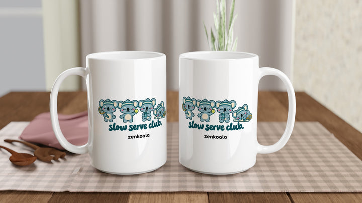 Two Slow Serve Club 15oz mugs on a table, showing both sides of the design, Zen Koala Australia