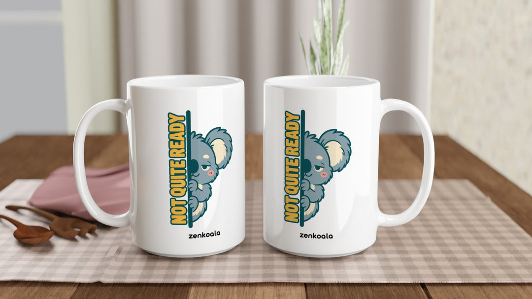 Two Not Quite Ready 15oz mugs on a table, showing both sides of the design, Zen Koala Australia
