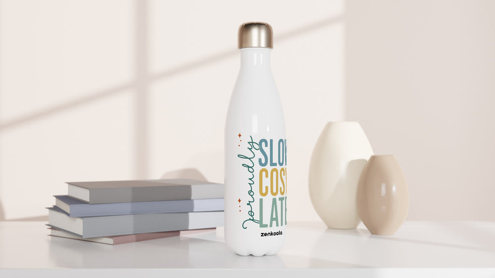 Proudly Slow Cosy Late water bottle beside books and vases, Zen Koala Australia