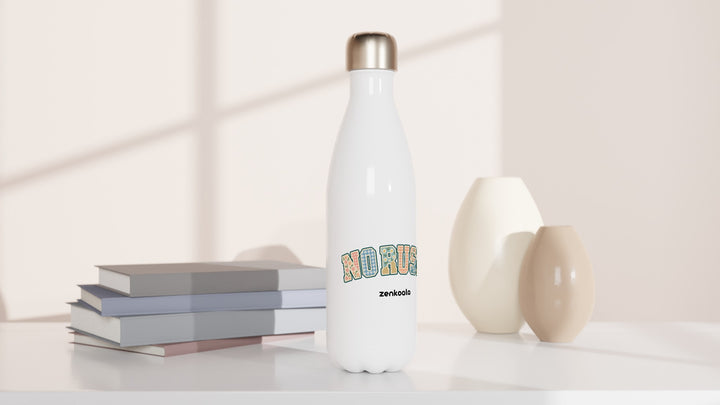 No Rush Faux Patchwork water bottle beside books and vases, Zen Koala Australia