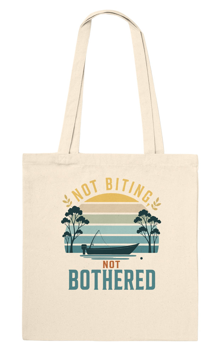 Not Biting Not Bothered feel-good tote bag in natural: a tinnie on still water under a retro sunset, Zen Koala Australia
