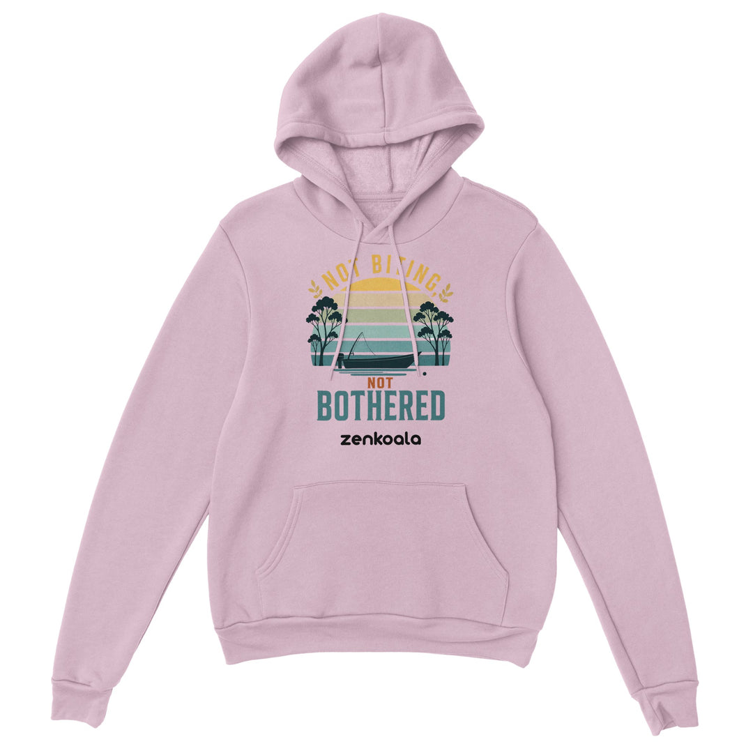 Not Biting Not Bothered feel-good hoodie in Light Pink — a retro Aussie sunset with a tinnie and gum trees, Zen Koala Australia