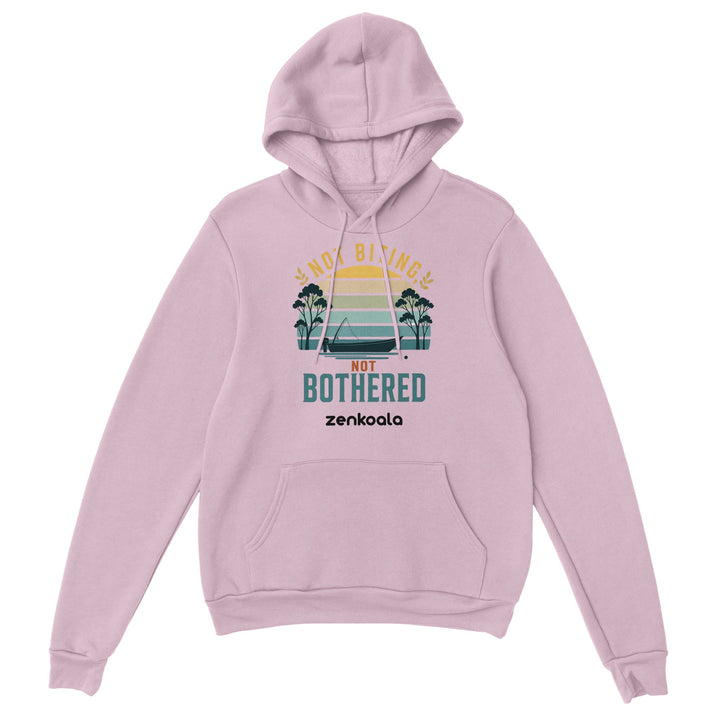Not Biting Not Bothered feel-good hoodie in Light Pink — a retro Aussie sunset with a tinnie and gum trees, Zen Koala Australia