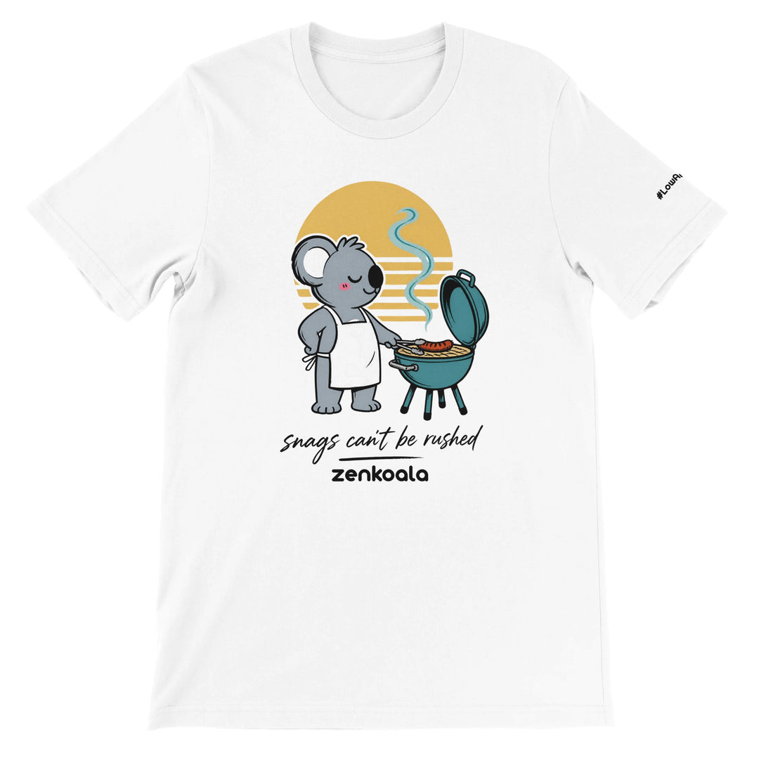 Snags Can't Be Rushed feel-good tee in white — a chilled-out koala in an apron cooking one snag on a kettle barbie, Zen Koala Australia