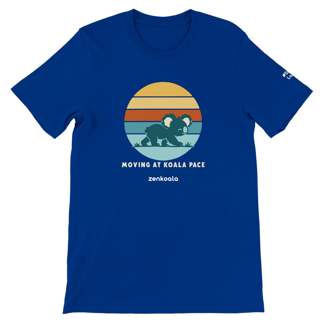 Moving at Koala Pace feel-good tee in true royal: a koala strolling across a retro sunset, Zen Koala Australia