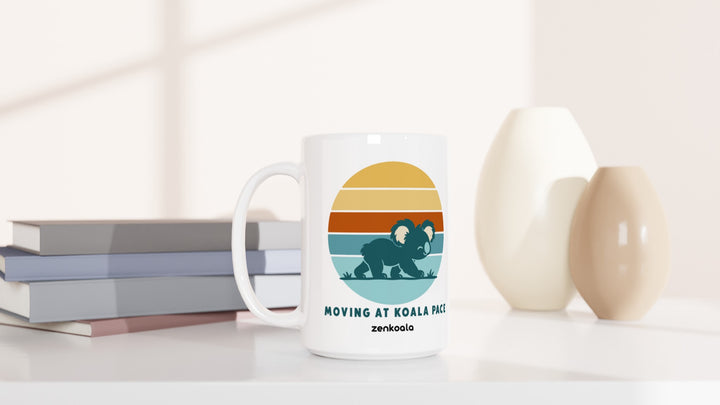 Moving at Koala Pace 15oz mug beside books and vases, Zen Koala Australia