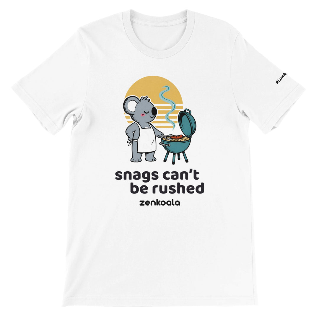 Snags Can't Be Rushed feel-good tee in white — a chilled-out koala in an apron cooking one snag on a kettle barbie, Zen Koala Australia