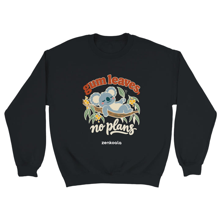Gum Leaves No Plans feel-good sweatshirt in black: a koala lazing on a gum branch among wattle, Zen Koala Australia
